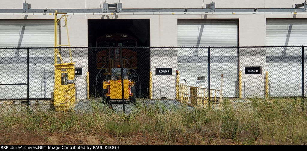 BNSF 3660 Has Been Pushed Back into The Load 1 Bay for Engine Run tests. The Transfer Dolly and Bobcat (Pushes the Locomotives into the Wabtec Bays) are in the Foreground.